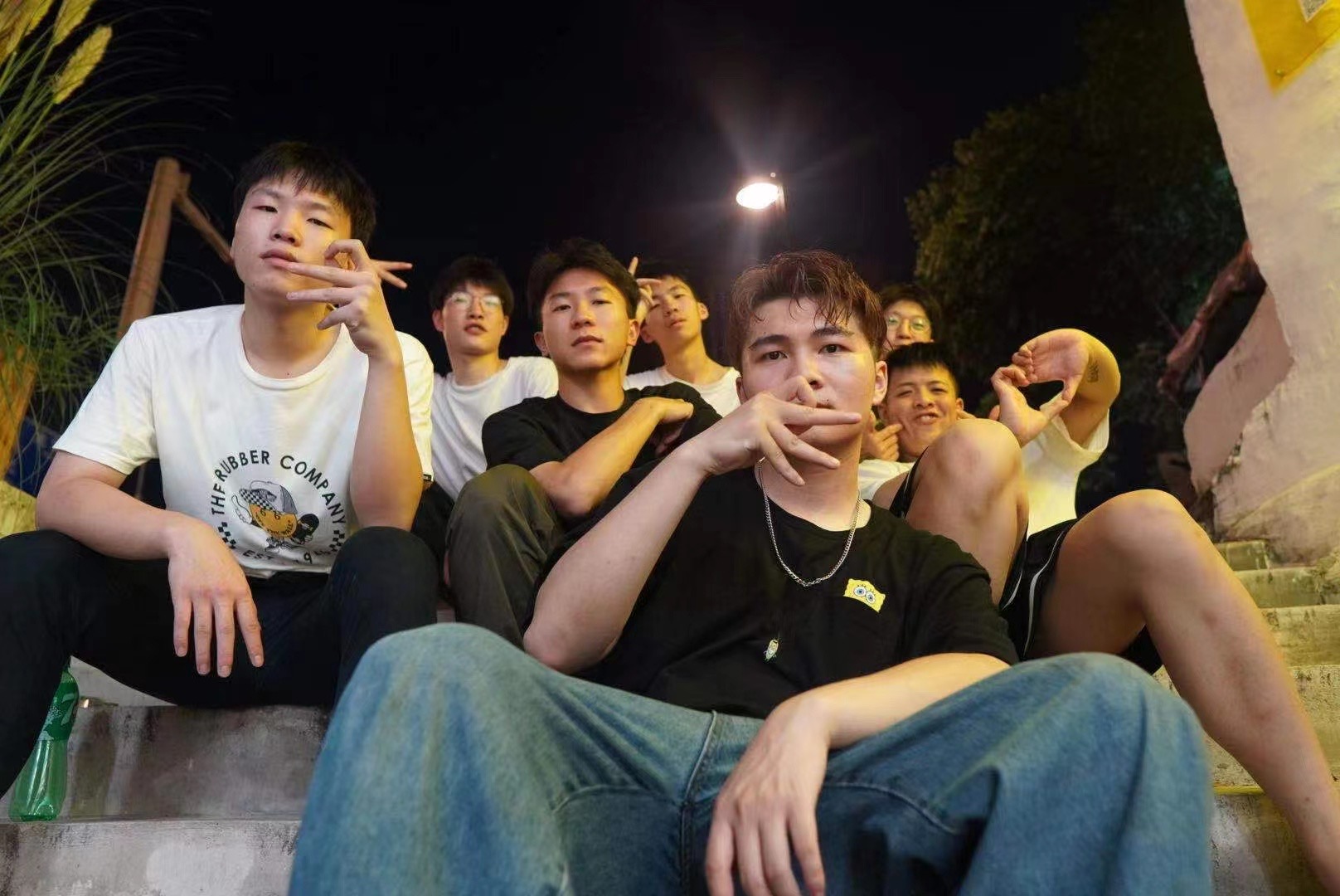 DreamError crew sitting together at night
